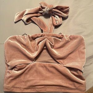 Around the neck, blush top.